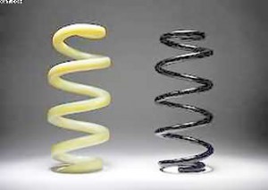 glassfibre car coil spring against a steel coil spring coil spring