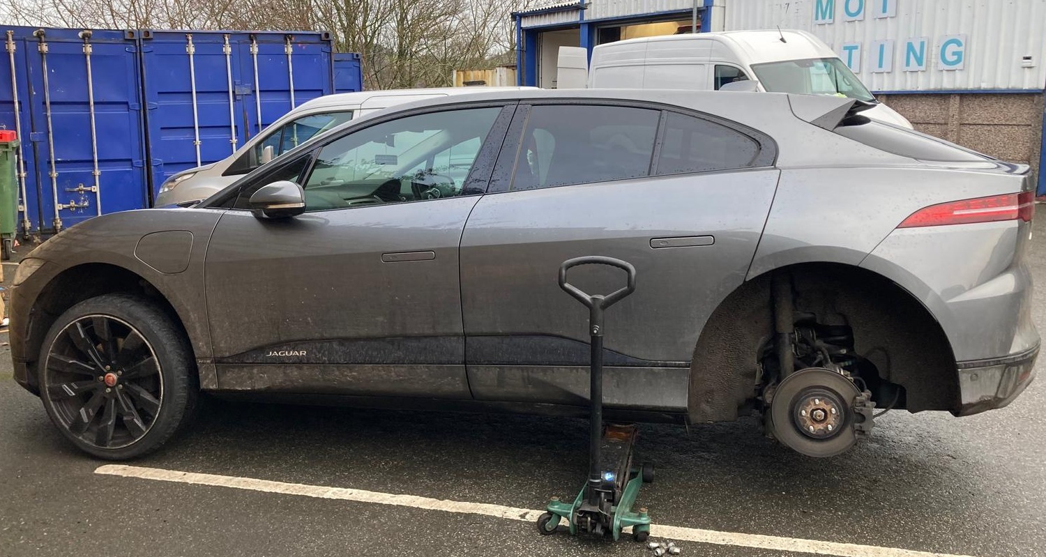 Jaguar with Pothole Damaged Wheel